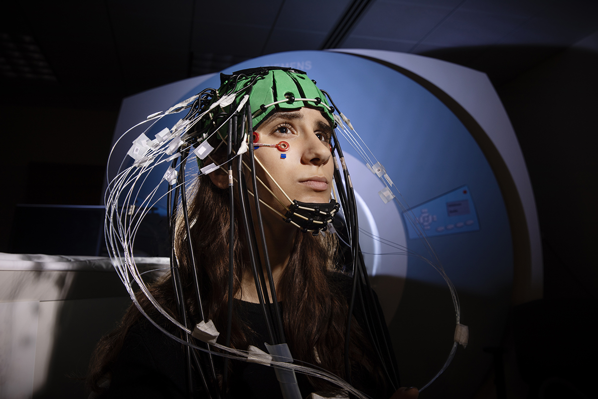 Student wearing a helmet with electrodes